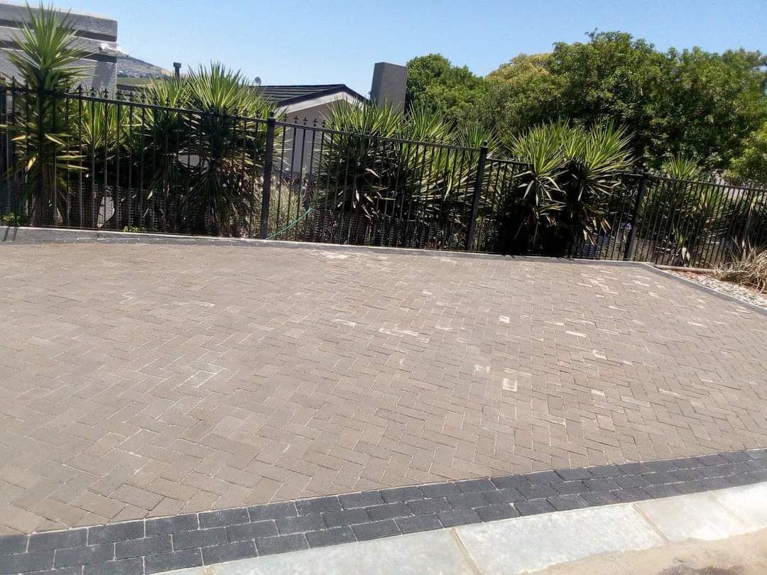 Paved driveway with landscaping