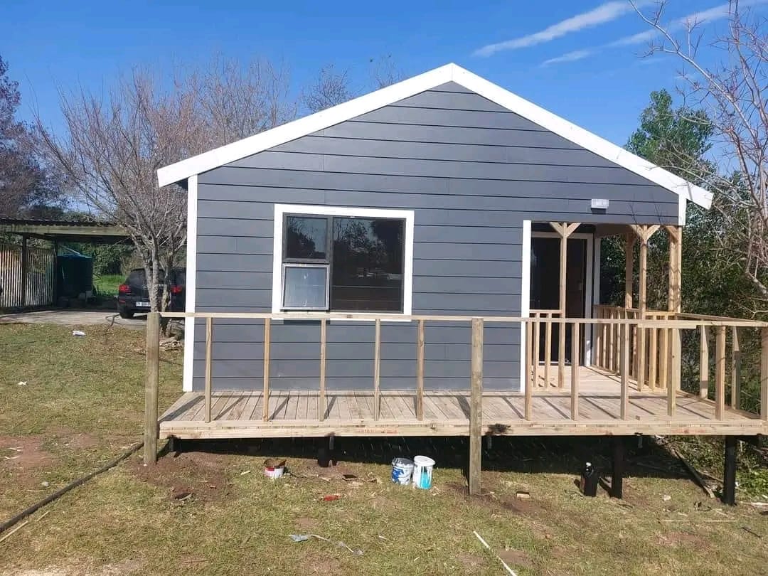 Gray Nutec house with deck